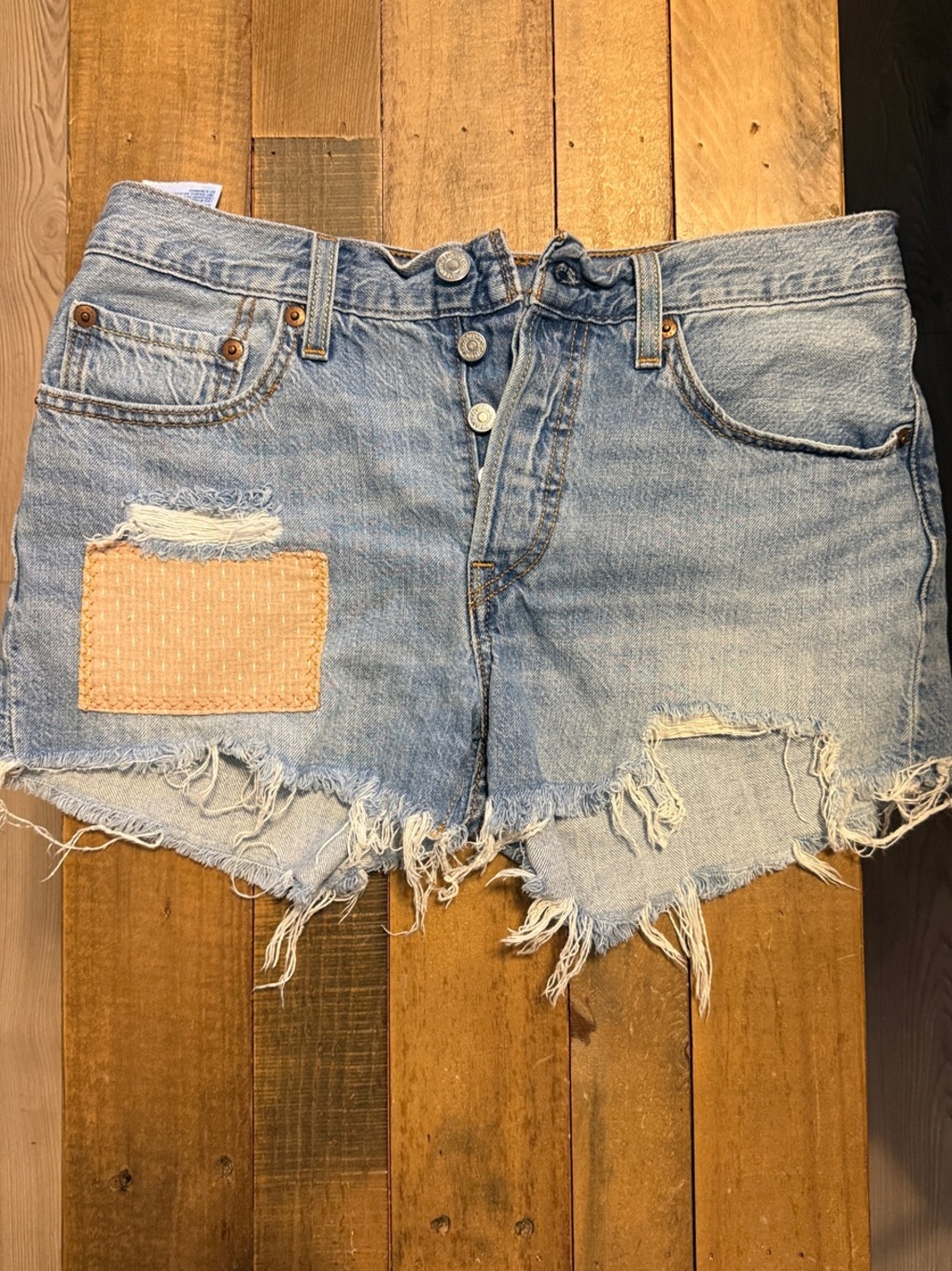 Levi’s 501 Light Blue Distressed Denim Shorts